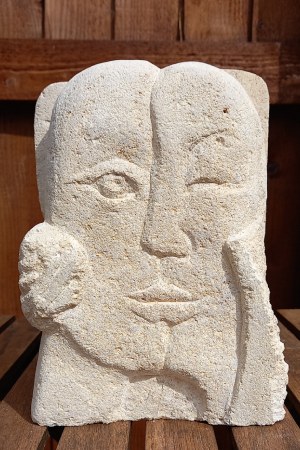 reverse side of Amore in pitted rough bath stone