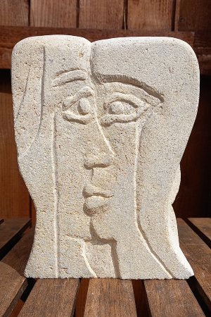 two profiles of a face merging together